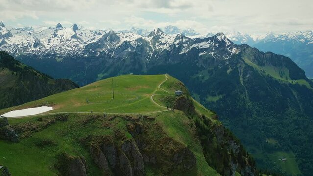Snowy mountains in Swiss Alps with footpath from Fronalpstock to Klingenstock
