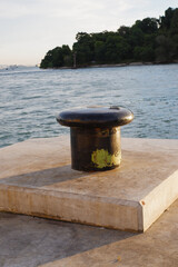 Naklejka premium mooring bollards for fastening the ropes of ships when docked at the harbor