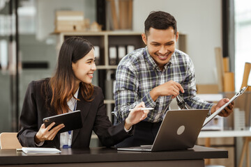 A middle-aged businessman, a young businesswoman, and Asian individuals are collaborating at desks. They engage in teamwork while managing commodities, trade, finance, and talent acquisition.