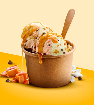 Vanilla and caramel ice cream balls in paper cup. 3D illustration