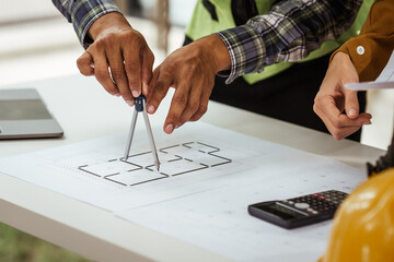 A middle-aged man, a young woman, and other Asian individuals collaborate on architectural engineering for condos and apartments, focusing on sustainable renovation and green energy solutions.