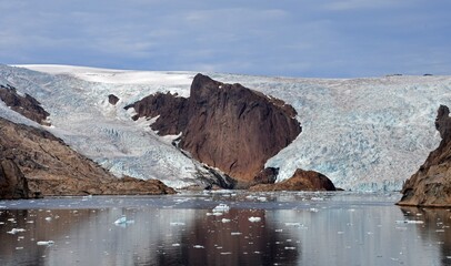 spectacular sermeq kajatleq  glacier in the steep mountains of the prince christian sound, in southern greenland, from a cruise ship © Nina