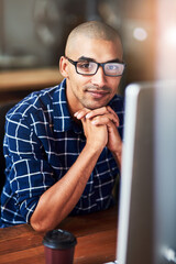 Portrait, glasses and creative business man on computer in startup office for career and job in...