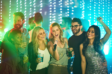 Friends, people and singing in nightclub together, night life and fun for celebration or new years...