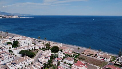 Aerial view of architecturally-designed modern prestige homes with pools in outer suburban Spain