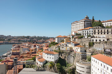 Panoramic views of the terracotta-roofed buildings descending towards the Douro River, famous...