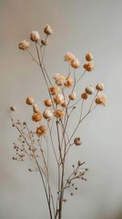 Vase filled with dried flowers resting on a table