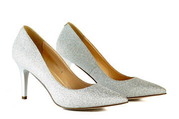 Women's red shoes from a varnish on a white background