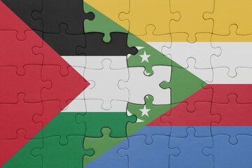 puzzle with the colourful national flag of comoros and flag of palestine.