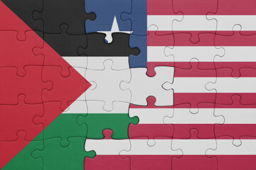 puzzle with the colourful national flag of liberia and flag of palestine.