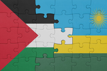 puzzle with the colourful national flag of rwanda and flag of palestine.