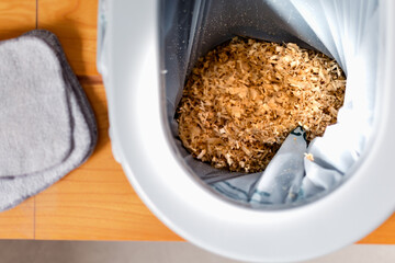 Dry toilet and washable wipe, water saving, compostable, wood chips, eco friendly gesture, durable lifestyle