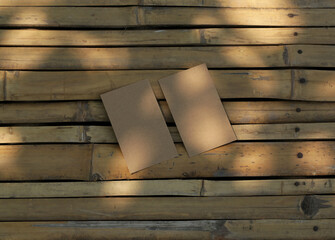 Card papers blank brown on natural dried bamboo wood background mock up template design concept.