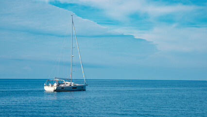 Fototapeta premium Yacht sailing boat on the sea, blue sky