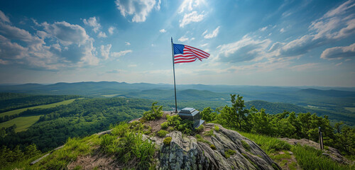 Fototapeta premium Panoramic views at a veteran's grave with a Memorial Day flag create expansive and poignant scenery from a hilltop vista.