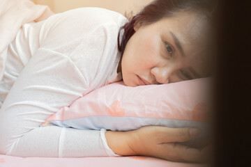 Side view unhappy woman feeling stressed or headache after sudden awakening in early morning