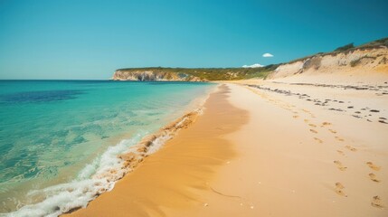 A serene beach with golden sand and turquoise waters, highlighting the tranquility of coastal environments