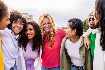 Happy young group of diverse girls having fun at city street. Female community and friendship concept.