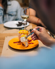 Gourmet Mango Dessert Served on Wooden Plate in a Restaurant