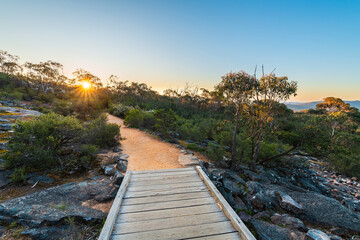 Beautiful Grampians mountains walking trail with boardwalk at sunset, Halls Gap, Victoria, Australia