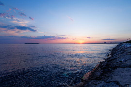 Dusk at Istanbul and the Maltepe coastline with pink cloudscape  in horizontal dimension