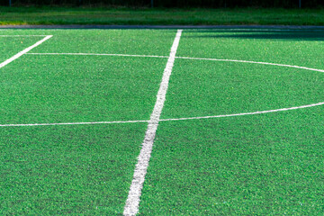 Obraz premium detail of the center line in a synthetic grass surface of a football field