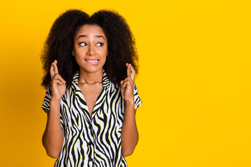 Portrait of glamour young charming woman curly hair in zebra print shirt crossed fingers nervous...