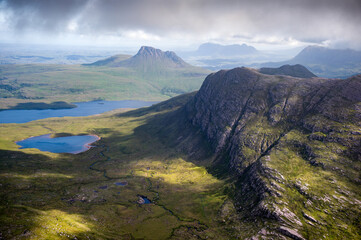 Views of Stac Pollaidh, Suilven and Cul Mor and Sgorr Tuath closest to the camera from the summit of Sgurr an Fhidhleir with Loch Lurgainn and Loch Dearg below in the Scottish Highlands in the UK. © Duncan Andison
