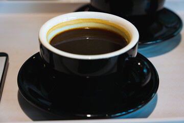 Black Americano Coffee and Lemon Cake on Side