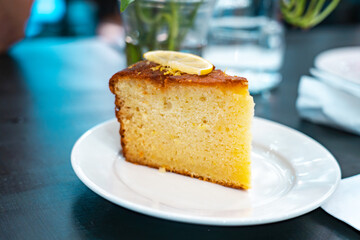 Black Americano Coffee and Lemon Cake on Side