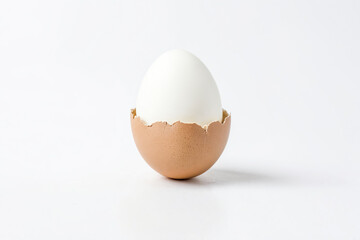 Close-up of a boiled egg in a cracked eggshell