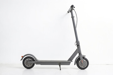 Gray electric scooter on white background