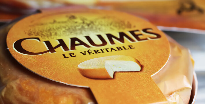 Viersen, Germany - May 9. 2024: Closeup of package french trappist style traditional cheese Chaumes from Perigord, France