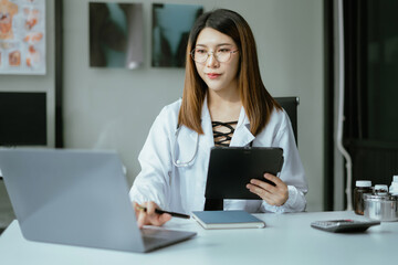Medicine doctor woman working with modern digital tablet computer and smartphone interface as medical network concept.