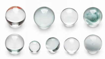Set of realistic transparent glass marbles isolated on white background, top view