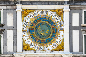 Fototapeta premium Vintage round zodiac, astrological calendar on the wall of an old building in the city of Brescia. Macro. Horizontal photo