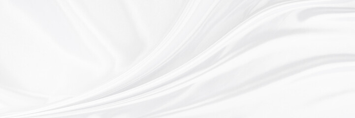 White gray satin texture that is white silver fabric silk panorama background with beautiful soft blur pattern natural.
