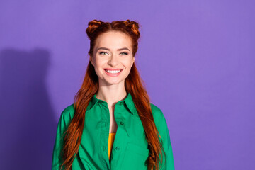 Photo of adorable good mood cute woman with ginger hairstyle dressed green shirt toothy smiling isolated on purple color background