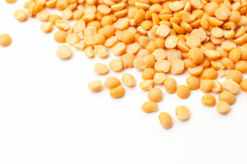 Split yellow peas pile on white background. Dry peas grains