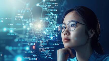 Focused Asian woman in glasses analyzing complex data and futuristic graphs. Blue tones dominate the high-tech background, highlighting the theme of technology and innovation.