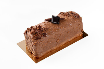 Artisanal loaf cake coated with milk chocolate and nuts glaze