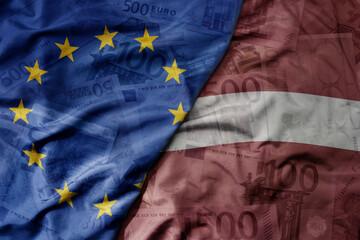 big waving realistic national colorful flag of european union and national flag of latvia on a euro...