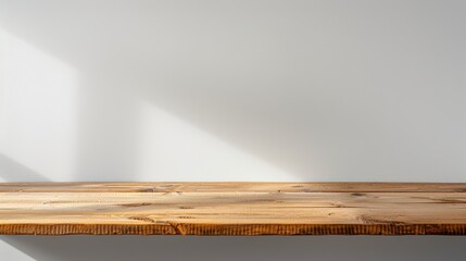 Minimalist wooden tabletop with vase and flowers in sunlight