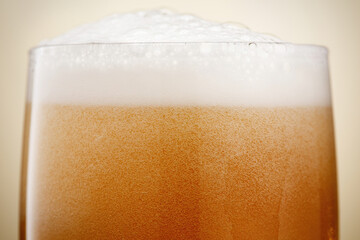 Beer. Glass of fresh and cold beer with bubbles. Shallow depth of field