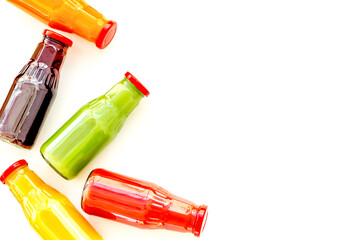 healthy organic juice in bottles for fitness diet and detox on white background top view mockup