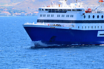 blue ferryboat crossing the blue sea - near Lemnos island, Greece, aegean sea
