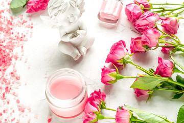 manicure set with nail polish and rose cream on white background top view