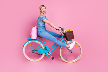 Full body profile portrait of nice young lady bicycle wear top isolated on pink color background