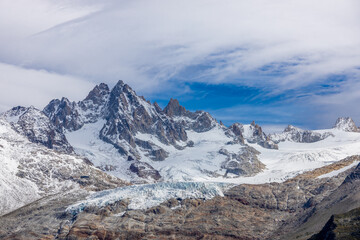 Fototapeta premium Chamonix Montblanc beautiful alpine mountain summits landscape. Alps mountains with snow and glacier above green valley of Chamonix in France. Alps beautiful scenery in summer