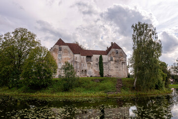 Fototapeta premium Jaunpils castle was built in 1301. as Livonia Order fortress. Latvia, aerial drone view
